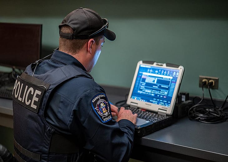 A police officer uses his computer in Georgetown, Texas, in 2023.