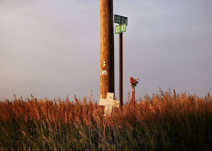 A cross marks the spot where people lost their lives in a car crash in Colby, Kansas. 