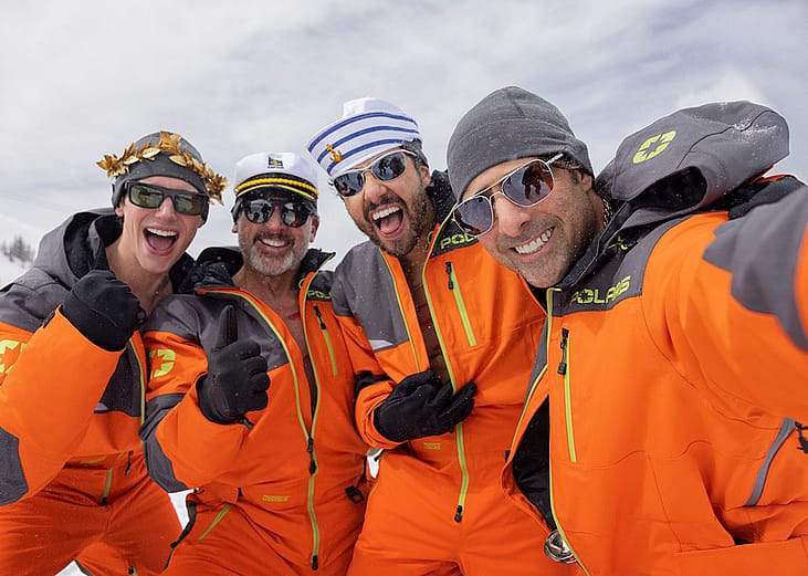 enis (Cory Michael Smith), Randall (Steve Carell), Jeff (Ramy Youssef) and Souper (Jason Schwartzman), from left, dressed in orange jackets in the show Mountainhead.
