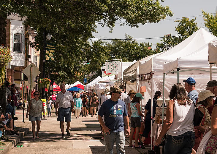 Customers and vendors at The Collingswood Craft and Fine Art Festival in New Jersey.