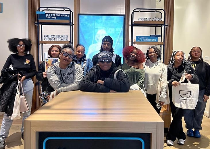 Group phot of mentors and mentees at H.D. Woodson’s Attendance Pep Squad who met with community partners to learn how to build a stronger school culture. 