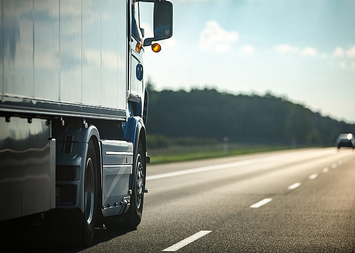 Long moving truck on a highway.