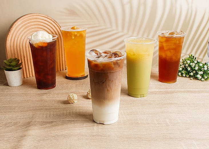 Assorted summer drinks such as coffee, milk tea, and fruit juice drinks.
