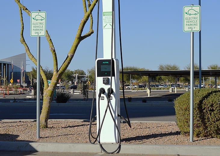 An Autel electric car charging station located at a business district.