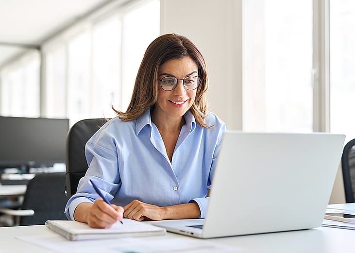 Middle-aged businesswoman working in a corporate office.