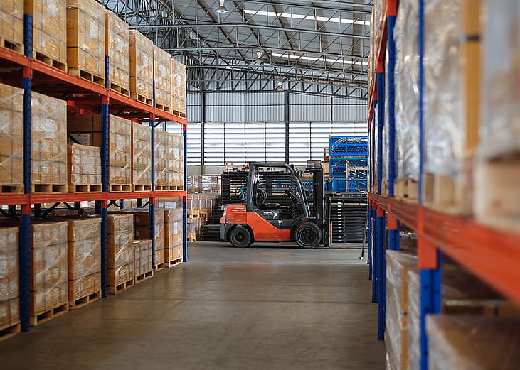 Interior of a modern auto parts factory or warehouse.