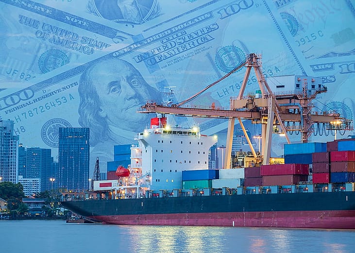 A crane loading a cargo ship at a shipping port.