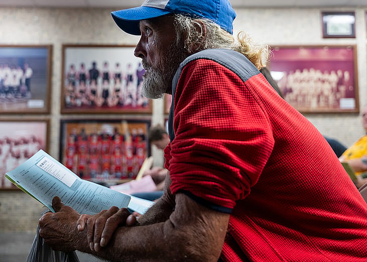 James Wolcott, a patient waits to take a vision test for a new pair of glasses at a Remote Area Medical (RAM) mobile dental and medical clinic at Terre Haute South High School, Indiana.