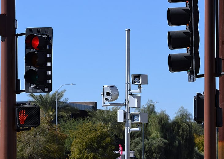Enforcement cameras along traffic lights.