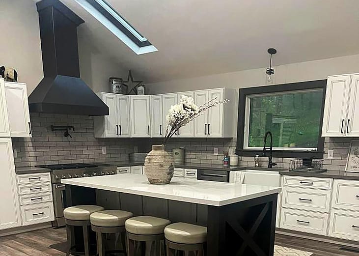 A modern kitchen with a sloped ceiling.
