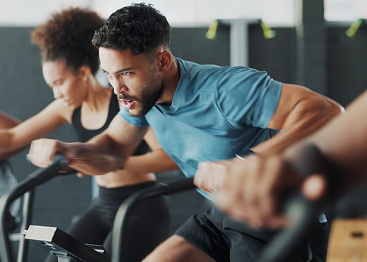 People during a fitness bike gym session.