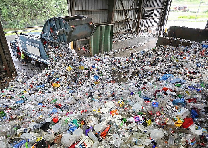 A truck dumps recyclable items at the Brookhaven Material Recycling Facility in Yaphank, New York.