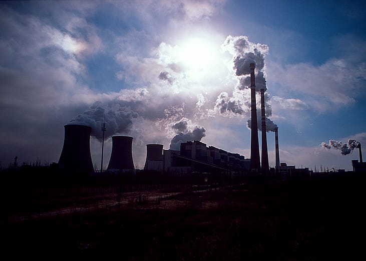 Silhouette of a coal-fired power plant spewing smoke into the air in Daqi, Inner Mongolia Autonomous Region, China.