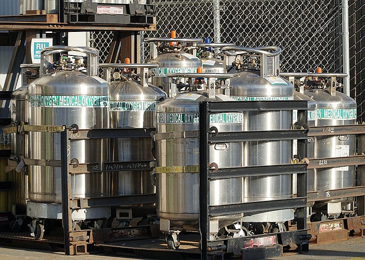  Industrial Oxygen cylinders waiting in racks outside filled and waiting to be put into use in Watsonville , California.