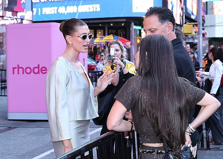 Hailey Bieber talks to guests of the Rhode x Sephora collaboration launch in New York Times Square.