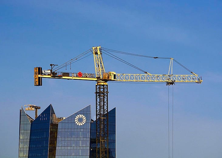 A tower crane owned by Torre Cranes in operation in downtown San Antonio, Texas.