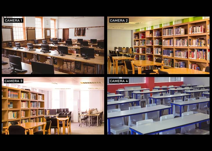 A composite view of security cameras surveilling four different areas of a school including classrooms.