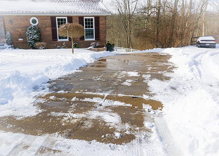 Long, steep, driveway in Kentucky after snow storm, all cleaned up with shoveling and salting. 