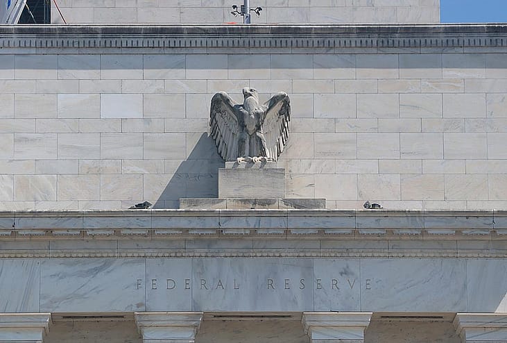 The Federal Reserve building with a figurine of the eagle above the doorway visible as it goes under construction on July 17, 2025 in Washington, DC. 