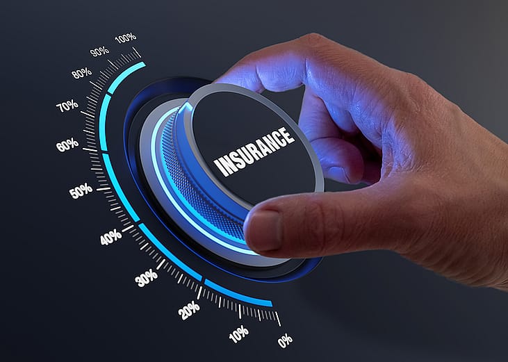 Concept of insurance coverage improvement depicted by a hand turning a knob to a higher insurance percentage.