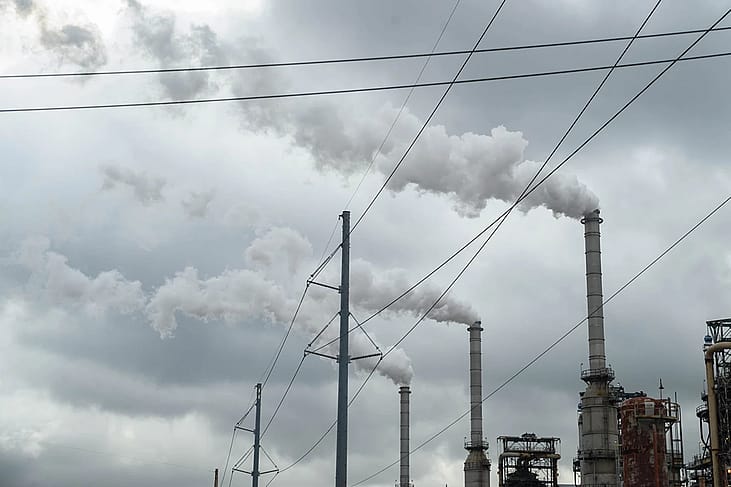 Plumes of smoke rise from three towers at Westlake Chemical's plant in Lake Charles, La. where President Donald Trump recently granted the facility a two-year exemption from stricter air quality standards. Experts say the move will increase toxic and greenhouse gas emissions for the surrounding neighborhoods. 