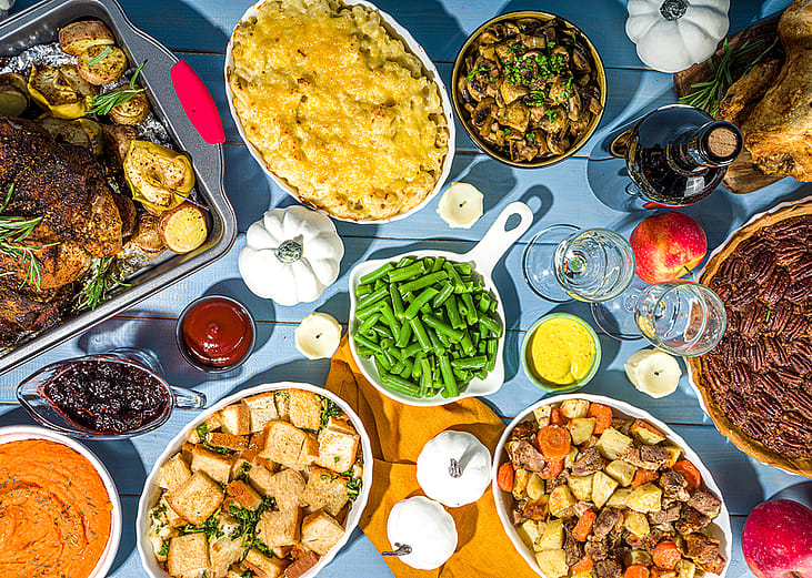 Traditional Thanksgiving food laid on a table.