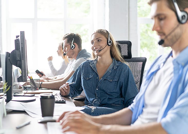 Customer support operators in their office.