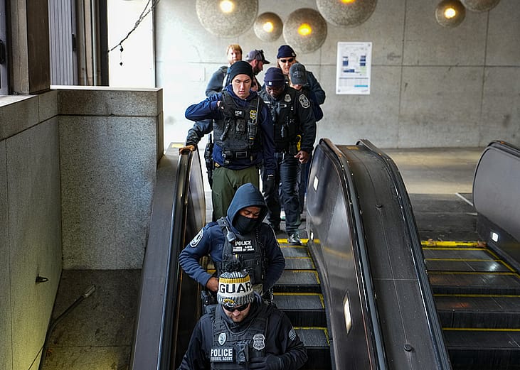 Federal and local law enforcement teams patrol the Farragut West Metro station on November 27, 2025 in Washington, DC.