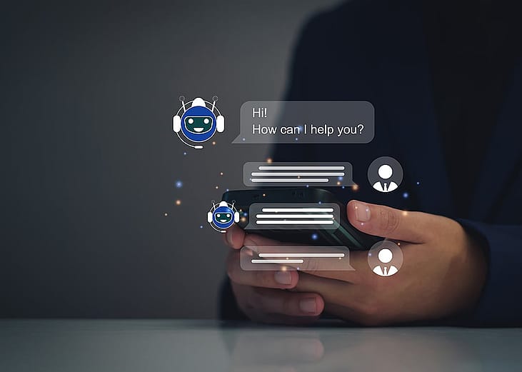 AI chatbot graphics over a person using a smartphone.