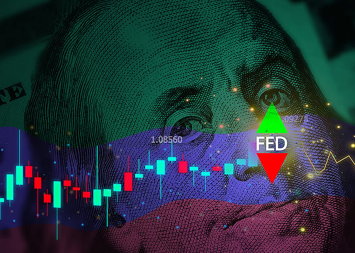 Close up on a US dollar banknote illustrated with Federal Reserve alerts with stock and currency chart graphics.