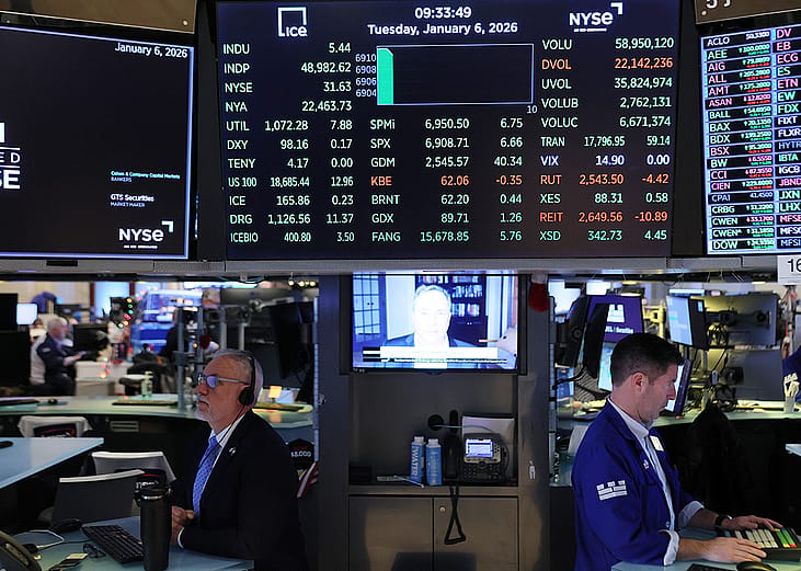 Traders work on the floor of the New York Stock Exchange during morning trading on January 06, 2026 in New York City. 