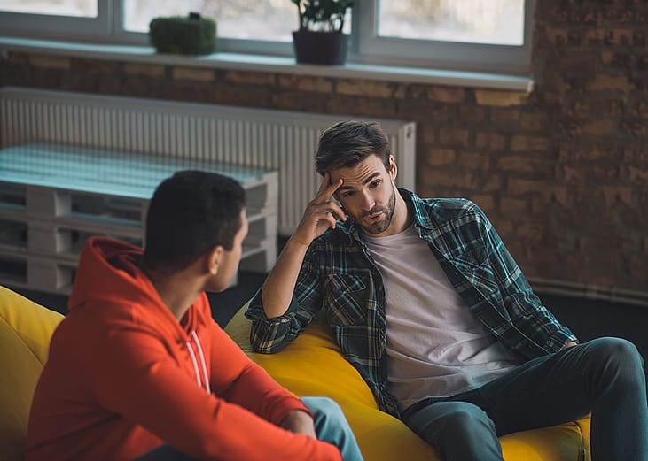 Two young men having a conversation.