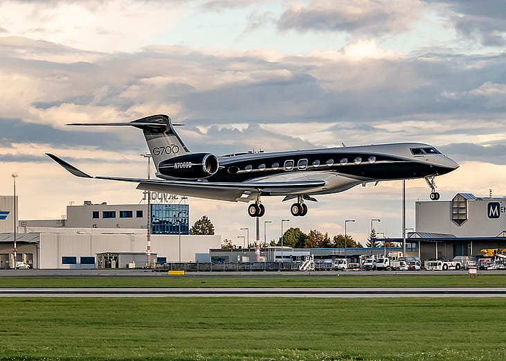 A Gulfstream G700 jet landing at Prague Airport.