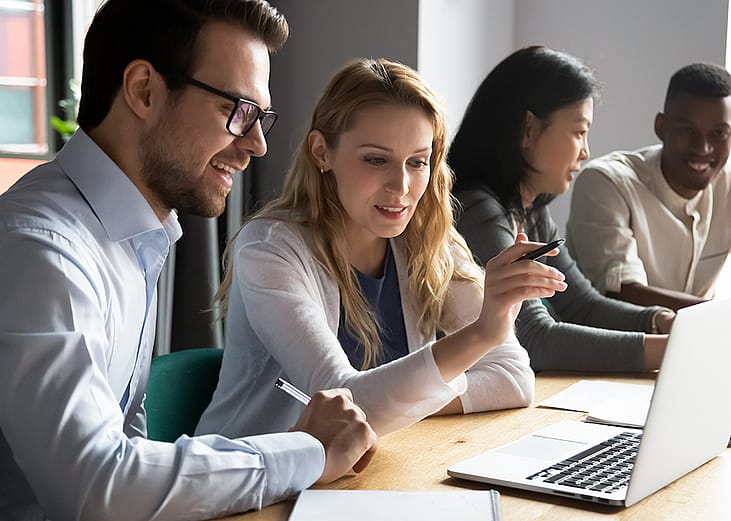 A diverse corporate team working together on a project.