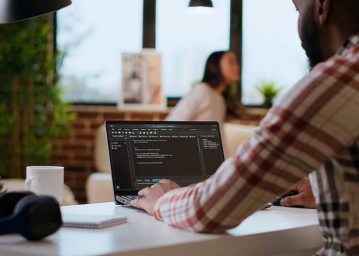 Software engineer working on coding a project.