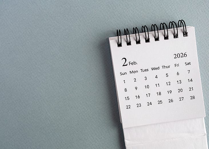 A small desk calendar showing February 2026.