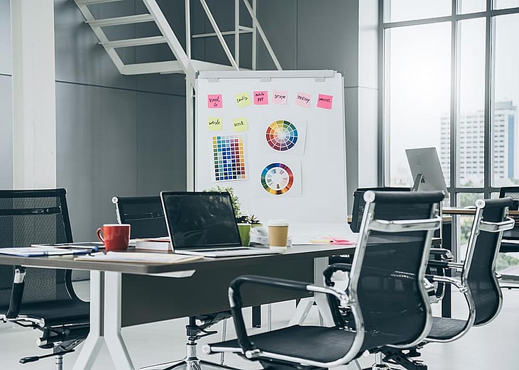 A modern office space with a creativity board.