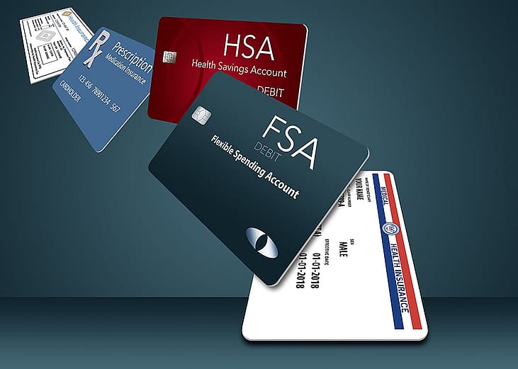3D illustration of a row of HSA, FSA, discount cards.
