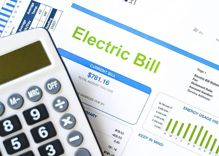 A calculator and an electric bill.