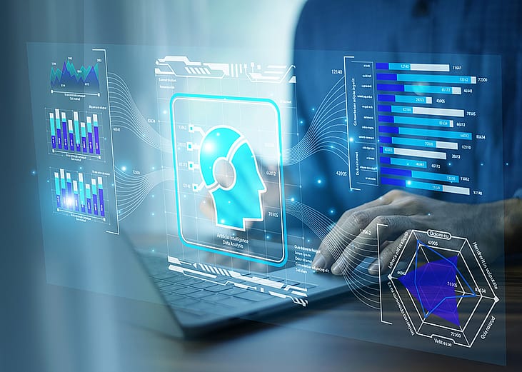 A businessman using AI-powered CRM technology on a laptop.