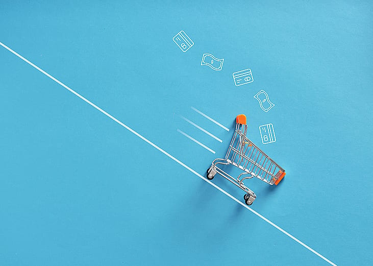 A shopping cart going down a line as a concept of fast shopping checkout.