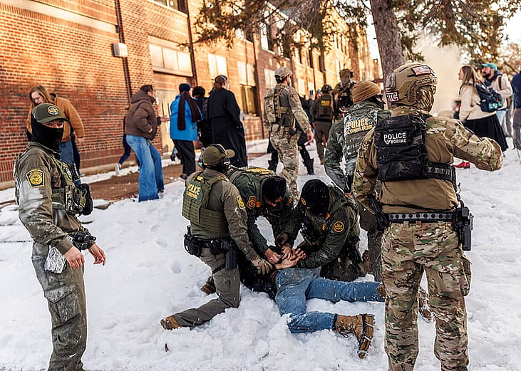 US Border Patrol / ICE agents detain a person near Roosevelt High School during dismissal time as federal immigration enforcement actions sparked protests in Minneapolis, Minnesota, on January 7, 2026. 