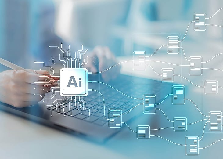 AI branching out graphics over a person using a laptop to illustrate data integration.