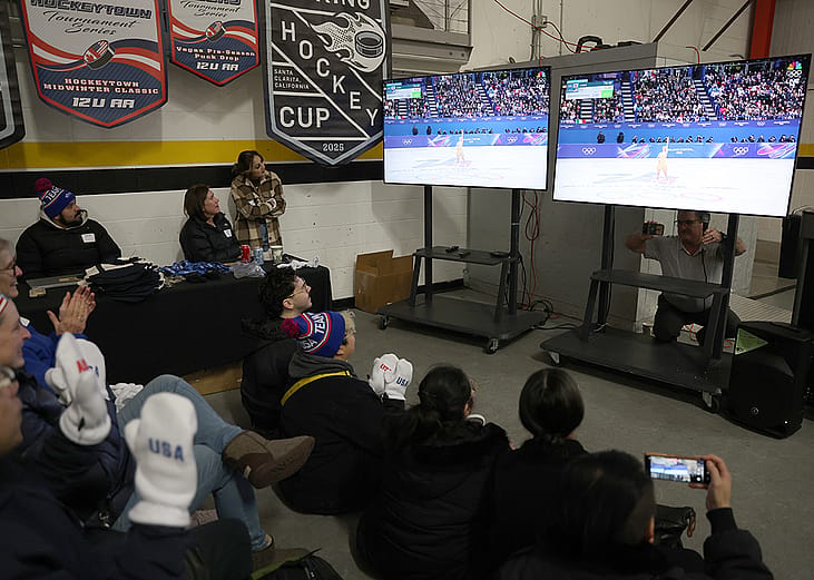 Community members watch local skater Alysa Liu compete in the Milano Cortina 2026 Winter Olympic games during a watch party at the Oakland Ice Center in Oakland, California on Thursday, Feb. 19, 2026