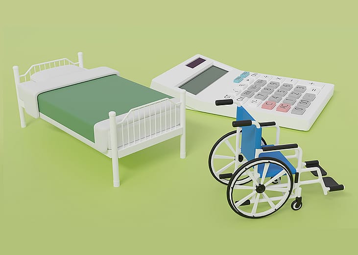 3D graphics of a miniature bed, a wheelchair, and a calculator as a concept of special care costs.