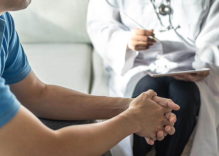 Man consulting with a doctor.