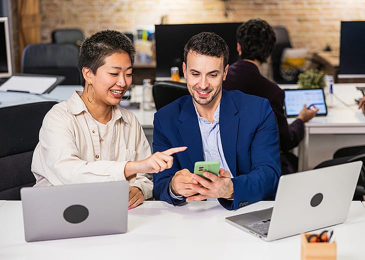 A diverse business team working together on a project in an office.