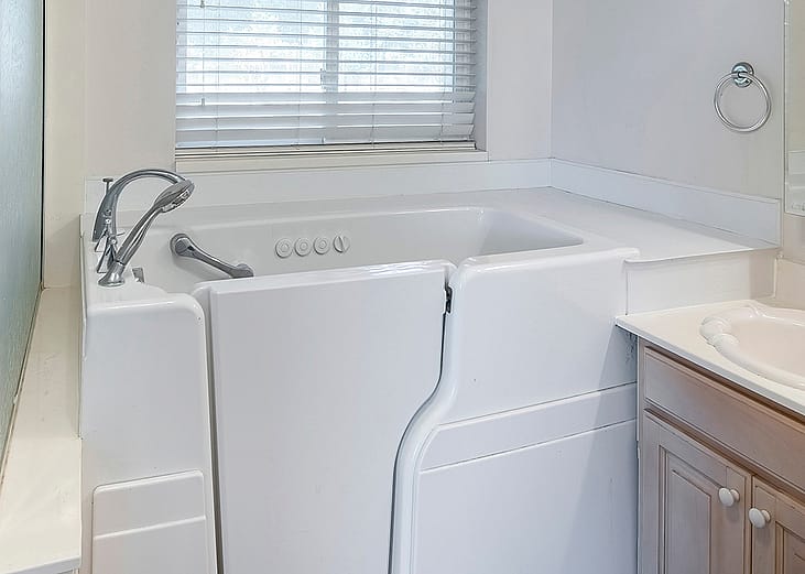 A square walk-in bathtub with elderly and handicapped accessibility.