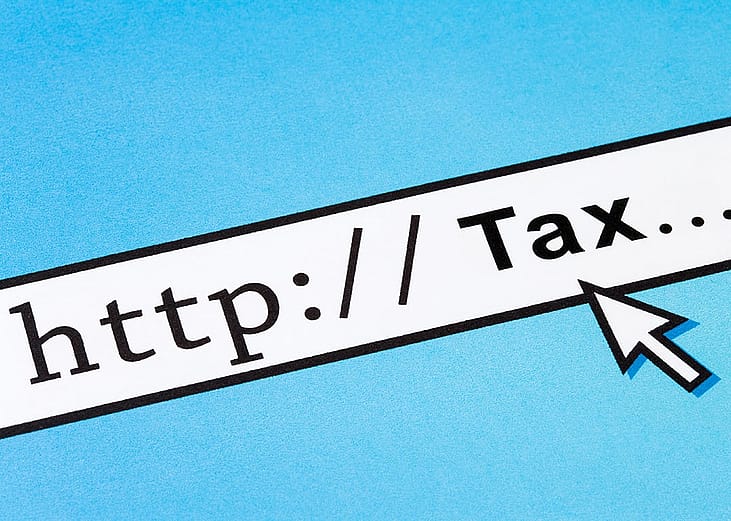 A URL bar with 'http tax' as the address as a concept of tax filing online.
