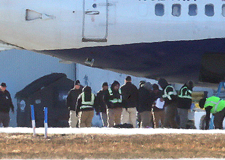 A charter flight picks up federal migrant detainees at Hanscom Field for a flight to Louisiana on December 12, 2025. 
